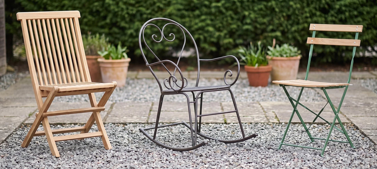 Wood, metal rocking, and green bistro outdoor garden chairs on display